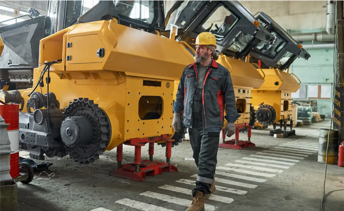 Man working in front of heavy machinery